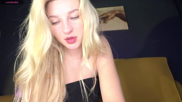 Zoe - Blonde with tattoos enjoys herself on the couch